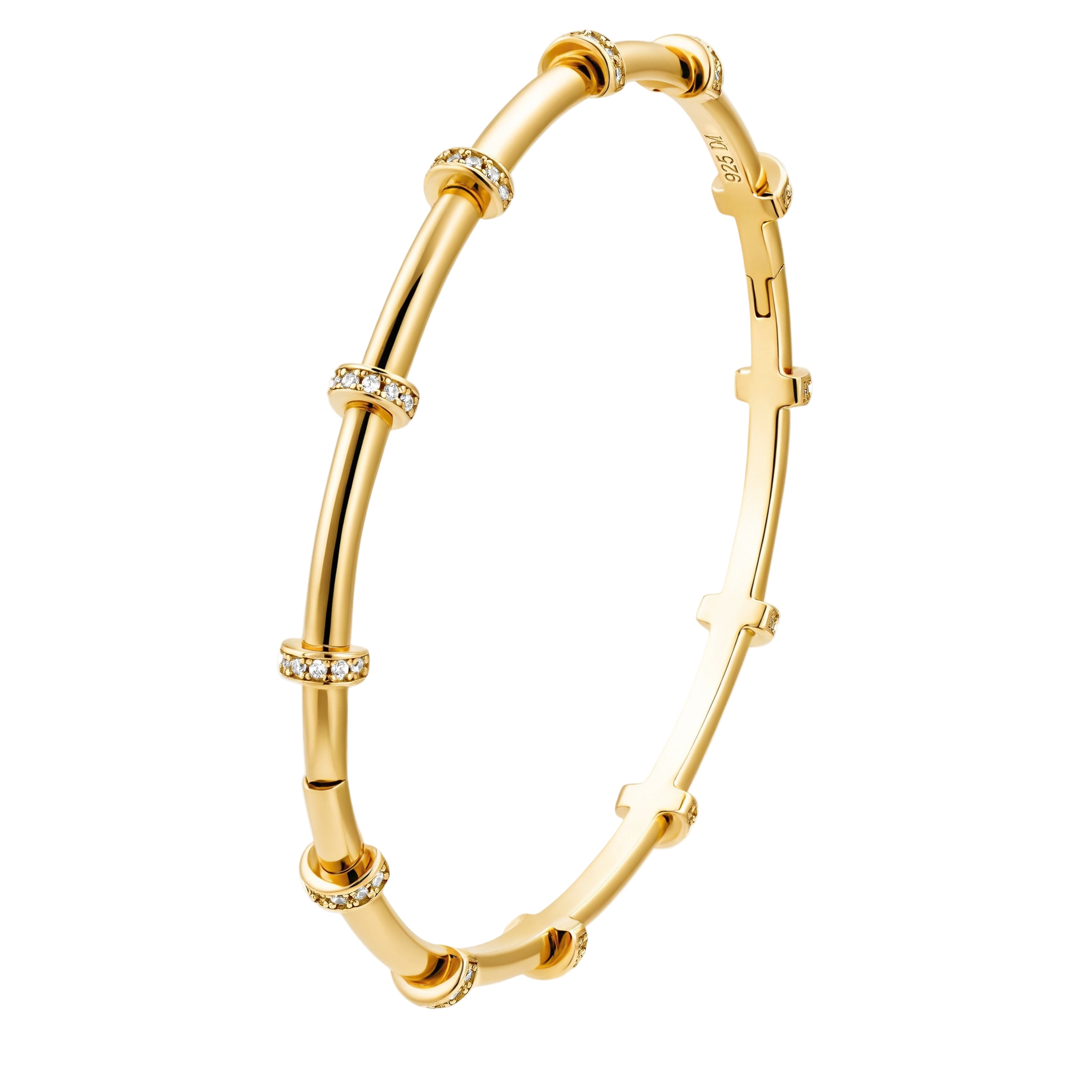 This image displays an elegant gold bangle bracelet, crafted with a sophisticated design. The bangle features a series of linked bamboo-inspired segments, each adorned with delicate white gemstones that add a touch of sparkle.